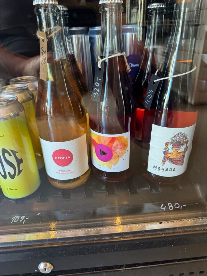 A fridge of natural ciders in a bottle shop