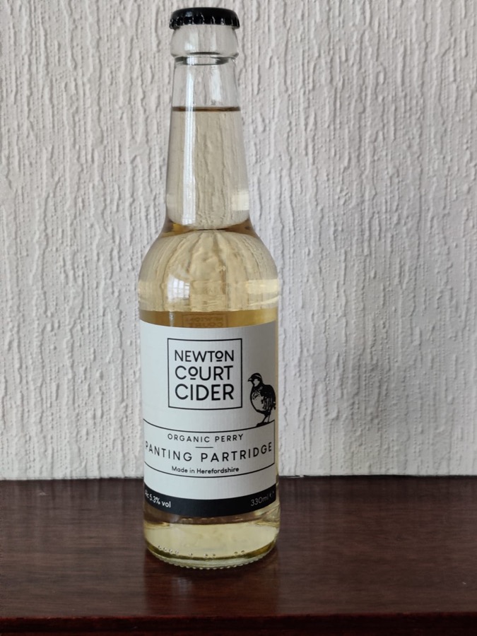 A bottle of Newton Court Panting Partridge organic perry
